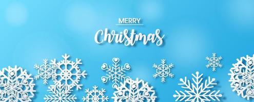 Closeup and crop variety snowflakes in paper cut style with MERRY CHRISTMAS texts on blurred and blue background. Christmas greeting card in vector and web banner design.