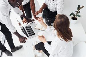 Group of african american business people working in office together photo