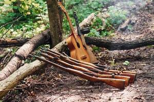 TERNOPIL, UKRAINE - June 2020 UPA Ukrainian Insurgent Army movie filming. Pictures of backstage. Weapons and acoustic guitar photo