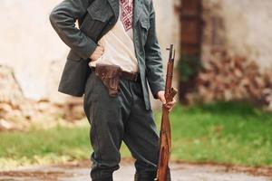 TERNOPIL, UKRAINE - June 2020 UPA Ukrainian Insurgent Army movie filming. Pictures of backstage. Close up view of young soldier with weapon photo