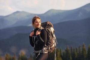 Woman having a walk. Majestic Carpathian Mountains. Beautiful landscape of untouched nature photo