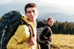 Young people enjoying. Majestic Carpathian Mountains. Beautiful landscape of untouched nature photo