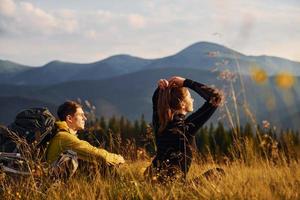 Young people enjoying. Majestic Carpathian Mountains. Beautiful landscape of untouched nature photo