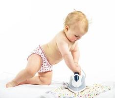 Little girl ironing photo