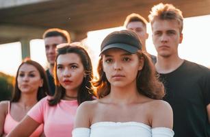 Group of protesting young people that standing together. Activist for human rights or against government photo