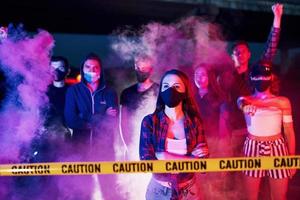 Smoke, fists, police. Group of protesting young people that standing together. Activist for human rights or against government photo