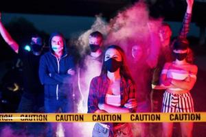 Smoke, fists, police. Group of protesting young people that standing together. Activist for human rights or against government photo