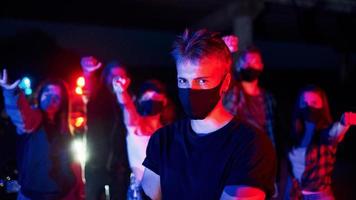 In protective masks. Group of protesting young people that standing together. Activist for human rights or against government photo