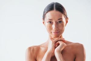 Portrait of woman that is in the studio. Conception of beauty photo