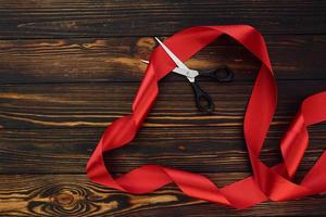 Top view of wooden surface with festive red cloth. Conception of valentine's day photo