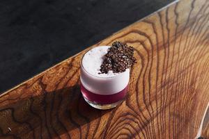Delicious drink. Close up view of fresh summer cocktail on the wooden table photo