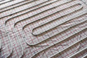 Pipes of underfloor heating system. Close up view. No people photo