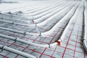 Pipes of underfloor heating system. Close up view. No people photo