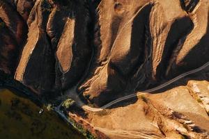 Aerial view of mountain and roads at daytime. Natural sunlight photo