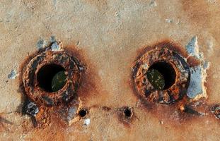 Old rusty textured metal surface. Conception of aging and decay photo