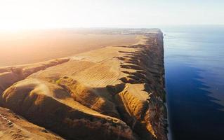 Edge of the hill. Aerial view of majestic landscapes of Jarilgach island in Ukraine photo