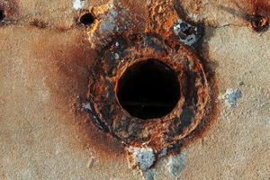 Old rusty textured metal surface. Conception of aging and decay photo