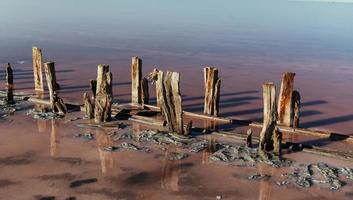 Wooden obstacles in the sea of Jarilgach island, Ukraine. At daytime photo