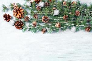 New Year or New Year's Eve background with fir branch with cones. The year 2023 is coming. photo