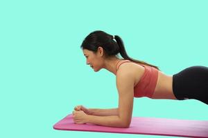 Woman doing plank exercise on transparent PNG background. photo