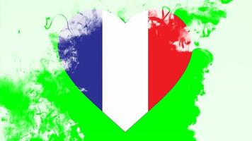 frankreich nationalflagge herzförmig aus pinsel in stop-motion-effekt. Anzeige der französischen Flagge mit grünem Hintergrund.