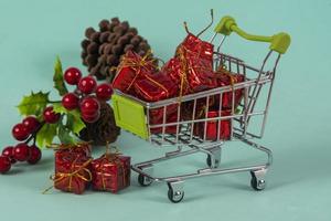 Christmas shopping cart with gifts and Christmas photo