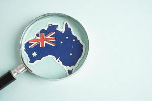 Australia flag and magnifying glass with copy space. photo
