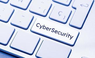 Cyber Security word on computer keyboard key photo