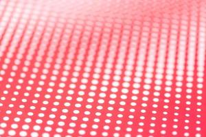 Red and white abstract background. Halftone pattern paper design. Selective focus photo