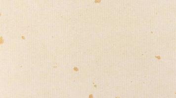 lazo de textura de papel a rayas crema decorativa. papel decorado con manchas doradas con fondo de rayas. orientación horizontal horizontal. video