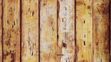 Weathered rough wooden background loop. Old planks texture. Vertical cross direction. video