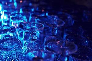 Close up view of row of empty glasses on table in the pub indoors photo