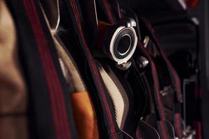 Firefighter's equipment in the car. Hoses hanging inside of vehicle photo