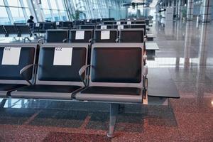 Interior of modern airport at daytime with no people inside it photo