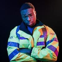 In police uniform. Futuristic neon lighting. Young african american man in the studio photo