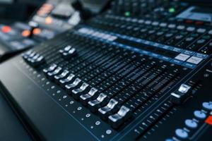 Close up view of radio mixing desk with professional sound equipment photo