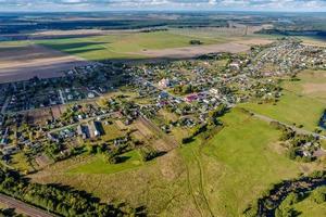 panoramic aerial view of private development with country houses or village photo
