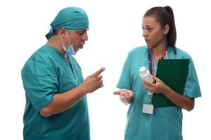 medical team doctor and nurse holding medications. health and medicare concept photo