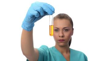 scientist working in the lab,  examines a test tube with liquid. medical concept. photo