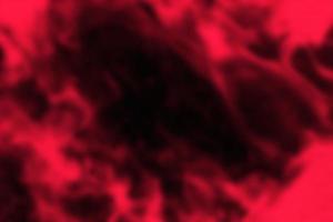 Red-black abstract blurred background. Black hole. photo