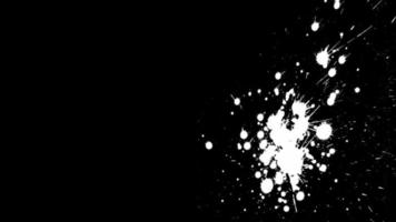 Isolated splashes of white paint on a black background video