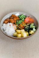 Salmon and vegatable bali bowl photo