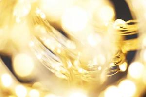 hermoso fondo de oro brillante de navidad. brillo festivo bokeh borroso foto