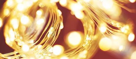 christmas beautifull shiny gold and red background. sparkle festive blurred bokeh photo