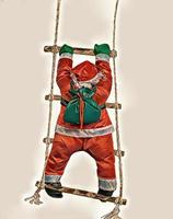 Santa Claus Climbing the Rope Ladder photo