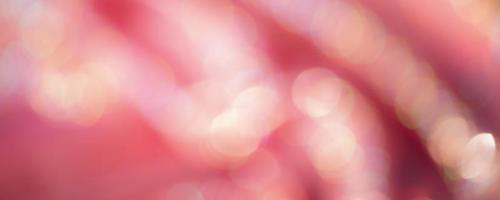 Defocus light pink. Blurred background pink fabric shiny. photo