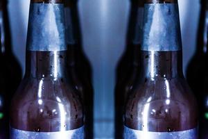Close up Beer bottle without logo in refrigerator photo