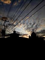 Silhouette of a mosque at sunset. beautiful sky photo