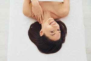 Close up view of woman that lying down on the couch photo