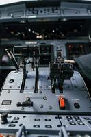 Close up focused view of cockpit electronics and control devices photo